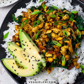 Easy and delicious new take on tofu! Shredding super firm tofu gives a wonderful texture. Serve with caramelized onion, spinach, some curry flavor, avocado, rice, and sesame seeds for the perfect quick weeknight meal! #veggielexi #veganrecipes #tofu #tofurecipes #glutenfreerecipes #vegandinner - by Veggie Lexi