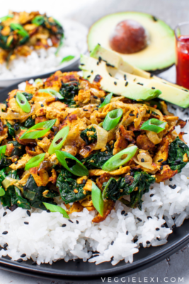Easy and delicious new take on tofu! Shredding super firm tofu gives a wonderful texture. Serve with caramelized onion, spinach, some curry flavor, avocado, rice, and sesame seeds for the perfect quick weeknight meal! #veggielexi #veganrecipes #tofu #tofurecipes #glutenfreerecipes #vegandinner - by Veggie Lexi