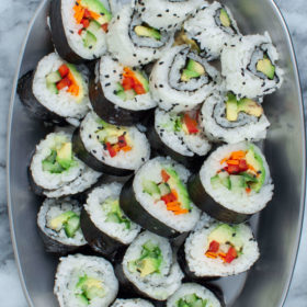 Vegan Sushi Rolls with Avocado, Carrot, Red Bell Pepper, Cucumber, and Vegan Cream Cheese