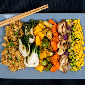 Vegan Fried Rice with Scallions, Sesame Seeds, Baby Bok Choy, Yellow Bell Pepper, Mayan Squash, King Oyster Mushrooms, Carrots, Edamame, Red Onion, and Corn