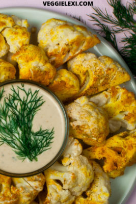 Delicious oil free roasted curry cauliflower makes the perfect healthy snack or side dish! Vegan, gluten free, low carb, and keto, too! #veggielexi #lowcarb #veganrecipes #lowcarbrecipes - by Veggie Lexi