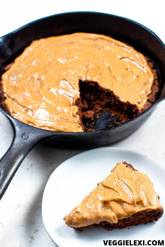 Easy and delicious chocolate skillet cake with almond butter icing. Vegan and gluten free, too! #veggielexi #veganrecipes #vegandessert #glutenfreerecipes - by Veggie Lexi