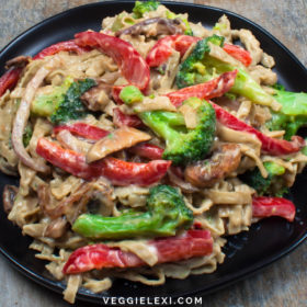 Fettuccine with healthy vegan Alfredo (oil free, nut free, and gluten free Alredo). Served with broccoli and red bell pepper.