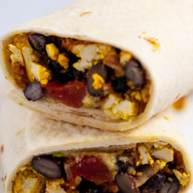 Easy vegan and gluten free breakfast burritos with scrambled tofu, salsa, avocado, and black beans. - by Veggie Lexi