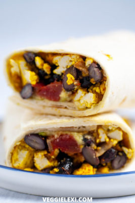 Easy vegan and gluten free breakfast burritos with scrambled tofu, salsa, avocado, and black beans. - by Veggie Lexi