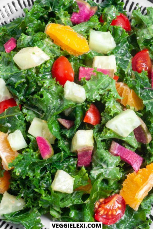 Kale salad with clementine, cucumber, watermelon radish, and cherry tomatoes. Vegan, gluten free, oil free. - by Veggie Lexi