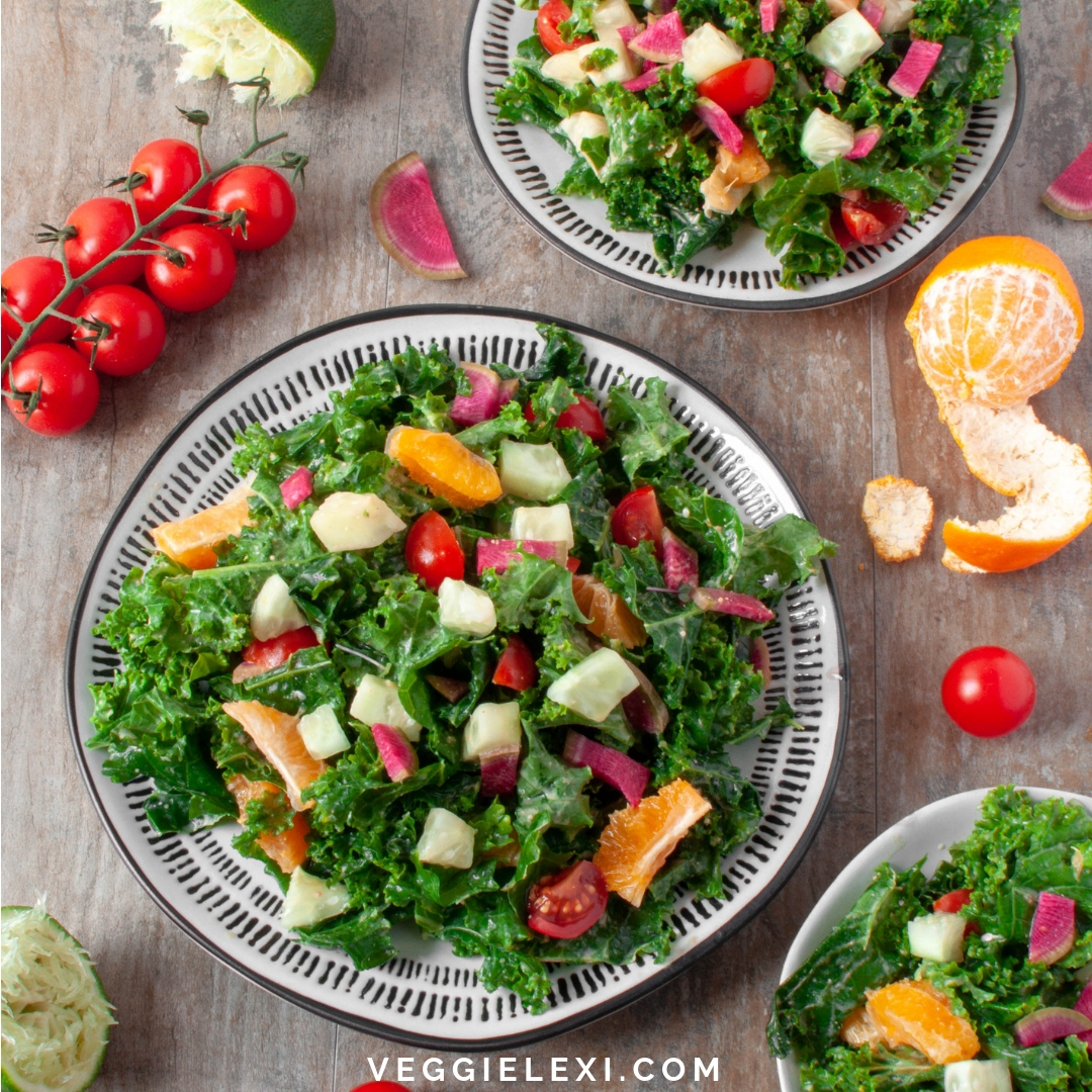 Kale salad with clementine, cucumber, watermelon radish, and cherry tomatoes. Vegan, gluten free, oil free. - by Veggie Lexi