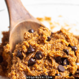 A mixing bowl full of healthy, vegan, gluten free, and refined sugar free cookie dough with chocolate chips.